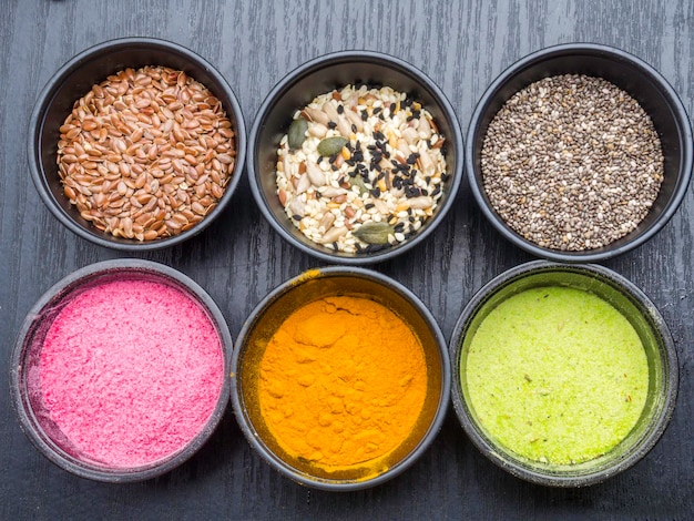 Different colorful superfood powders seeds detox concept