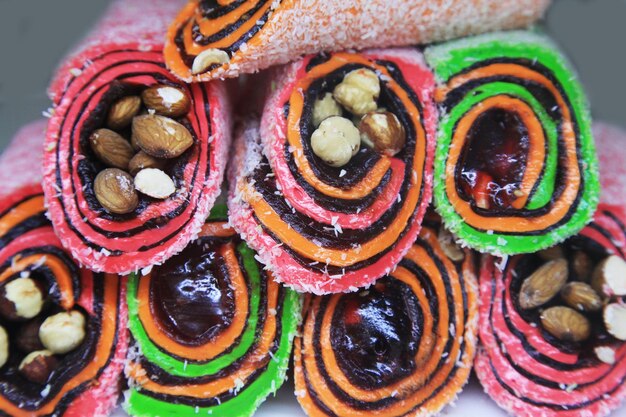 Different colorful tasty Turkish sweet as background