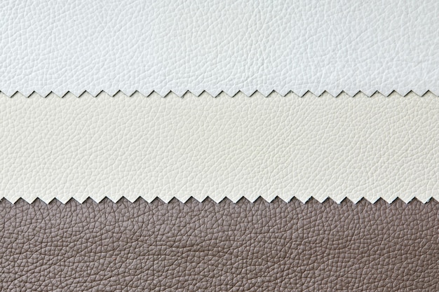 Different colors natural leather textures samples in light grey brown and beige tone color for design work