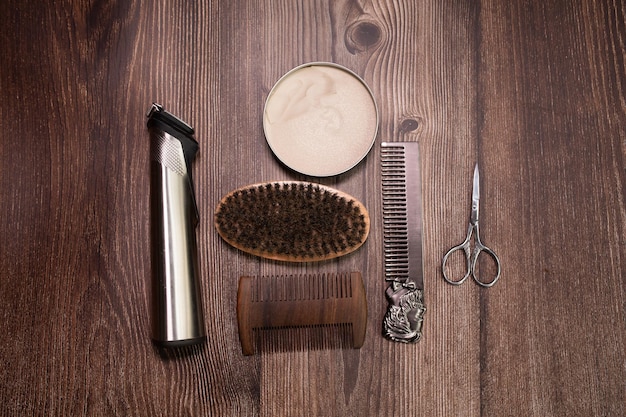 Different combs, brush, balm and other tools for grooming a beard. Close up view.