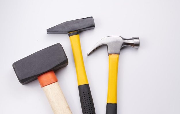 Different construction hammers isolated on white background closeup