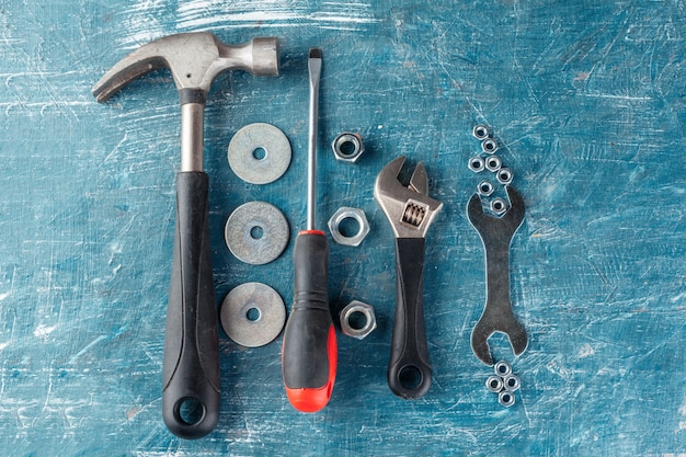 Different construction tools on blue 