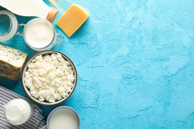 Different dairy products on blue background