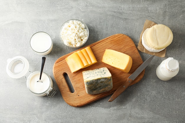 Different dairy products on grey background