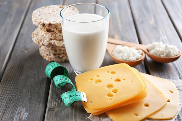 Different dairy products on wooden background