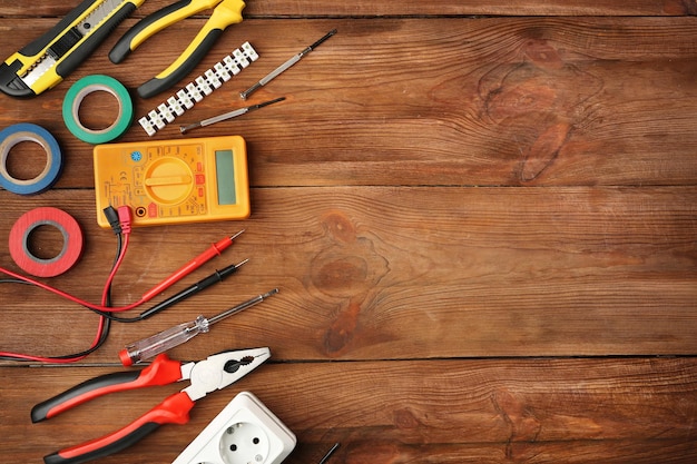 Different electrical tools on wooden table