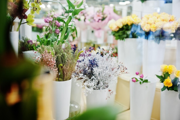 Different flowers on pots at flower store