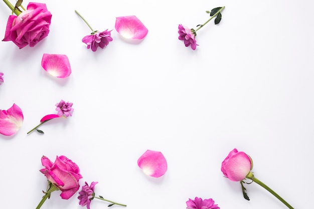 Different flowers scattered on table