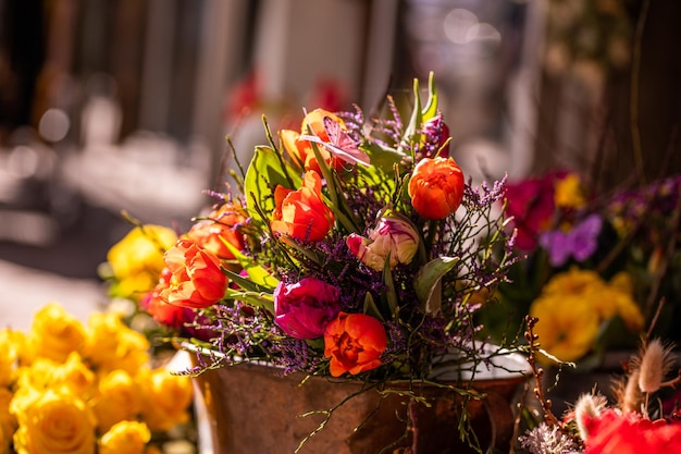 Different flowers and seedlings near the florist flower shop entrance spring time easter concept