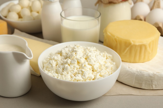 Different fresh dairy products on gray background, close up