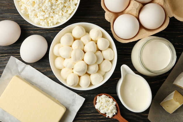 Different fresh dairy products on wooden background