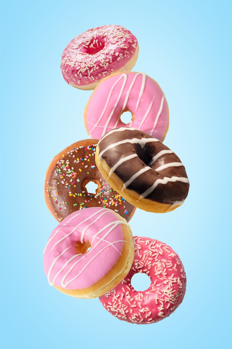 Photo different fresh donuts on blue