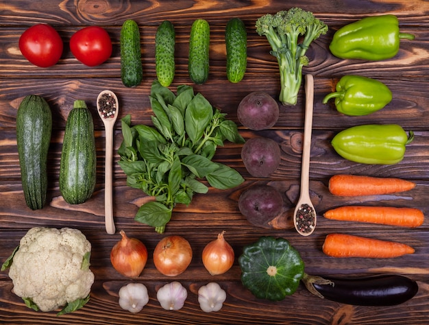 Different fresh farm vegetables laid out various colourful vegetables