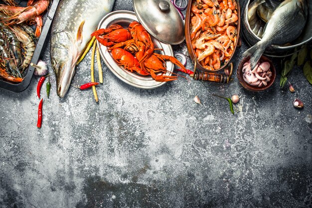 Different fresh seafood. On a rustic background.