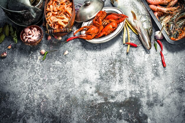 Different fresh seafood. On a rustic background.