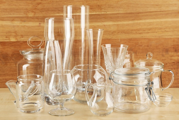 Different glassware on wooden background