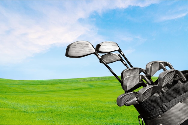 Photo different golf clubs .