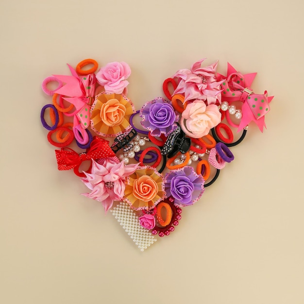 Different hair clips on beige background Flat lay Top view