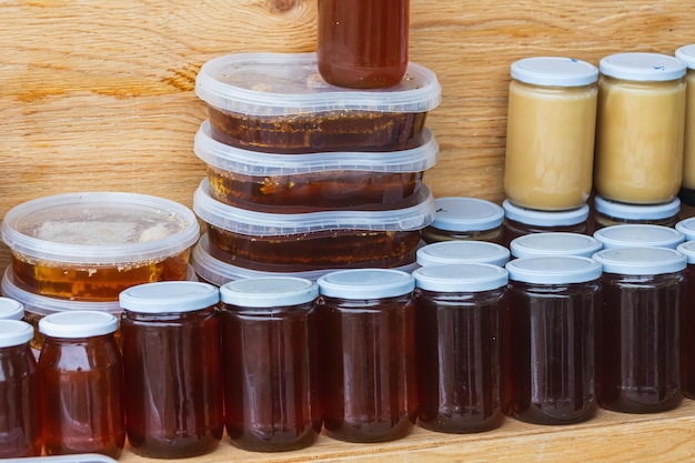 Different honey jars on a market