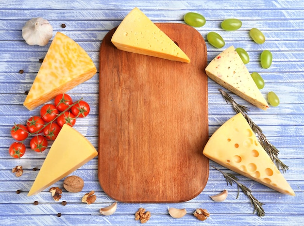 Different Italian cheese on wooden table