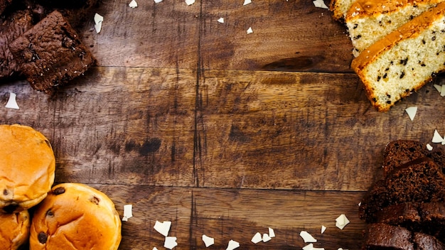 Different kinds of cakes arranged on a wooden tray