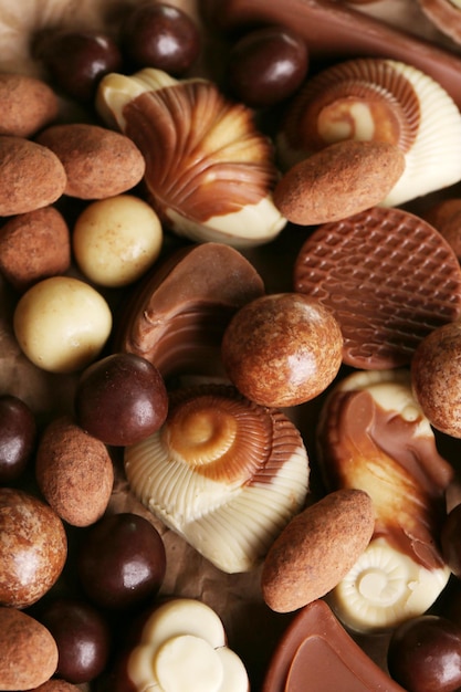 Different kinds of chocolates close-up background