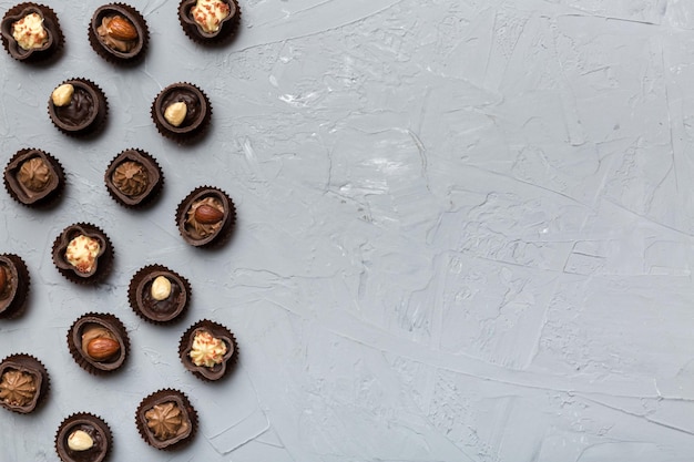 Different kinds of chocolates on colored table closeup Top View and Flat Lay with copy space