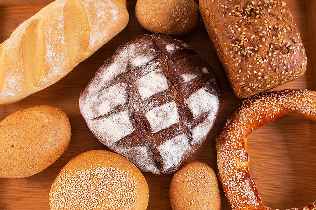 Different kinds of fresh bread on a tray