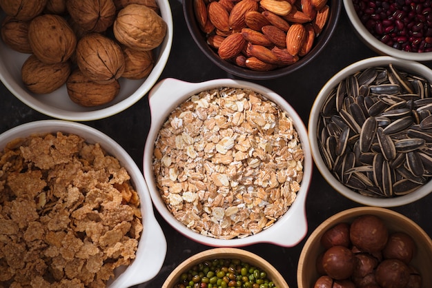 Different kinds of nuts in bowls.