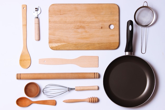different kitchenware on a light background top view. cooking appliances. flat lay . high quality photo