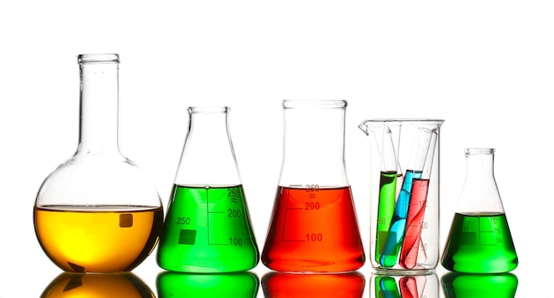 Different laboratory glassware with color liquid and with reflection isolated on white