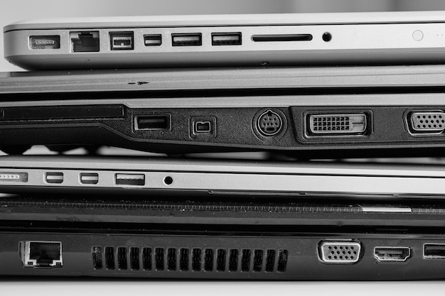 The different laptops placed on a table on a roll Horizontal indoors shot