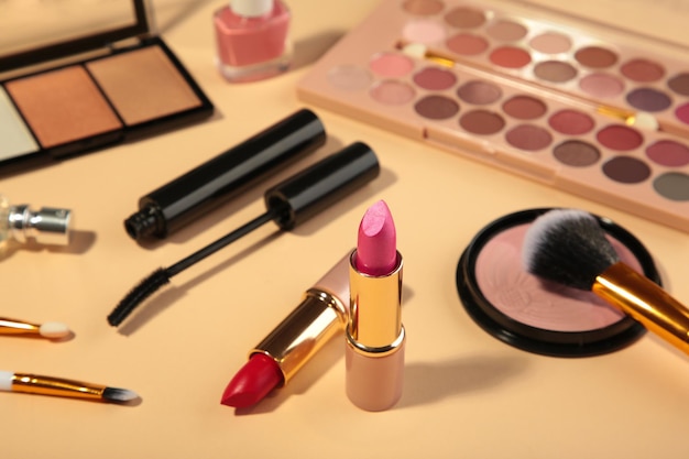 Different luxury makeup products on beige background, flat lay.\
make up cosmetics