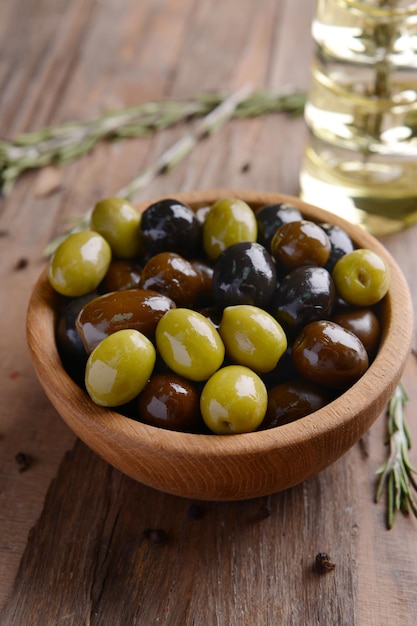 Different marinated olives on table closeup
