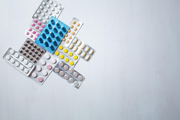 Different medicines tablets pills in blister pack medications drugs macro selective focus