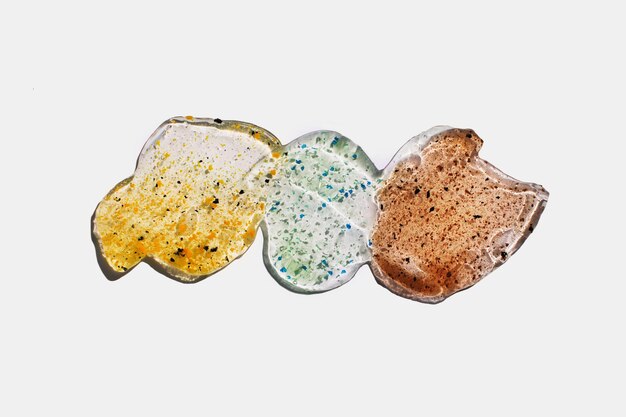 Different natural Scrubs set with particles isolated on white Swatches of transparent cosmetic gels with hard shadows