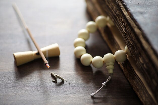 Different objects with traditional religious oriental on a wooden background