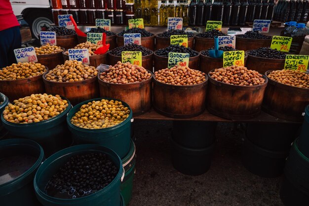 Different olives sale in the traditional farm turkish market a counter filled with fresh fruits