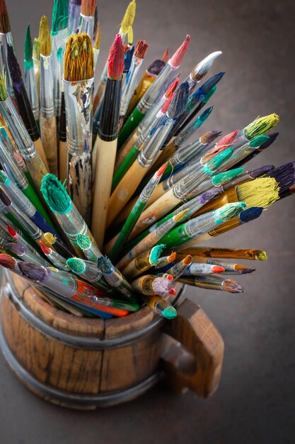 Different paintbrushes on a blurred background