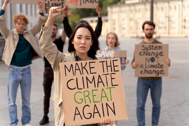 different people marching in climate change protest