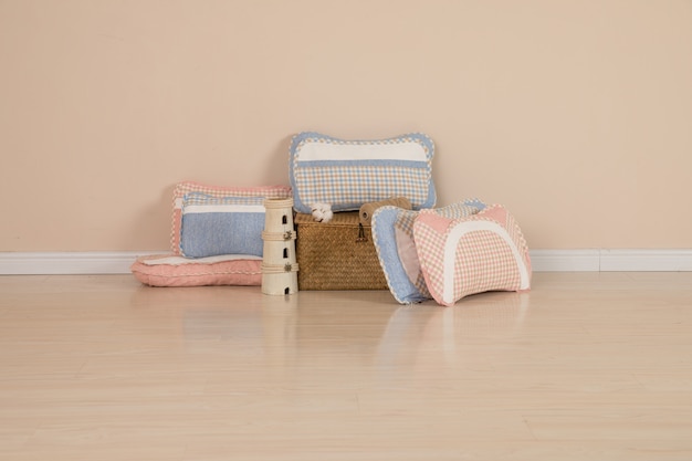 Different pillows on chair in room