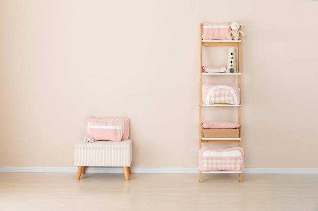 Different pillows on chair in room