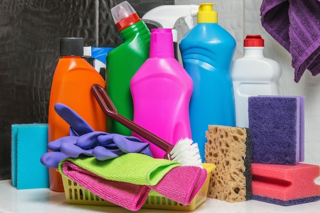 Different products and items for cleaning on the toilet and bathroom.