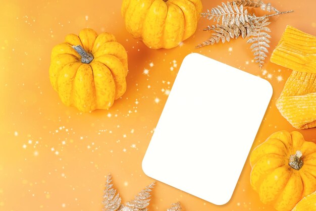 Different pumpkin varietiesorange backgroundspace for text and copy space autumn postcard minimalist