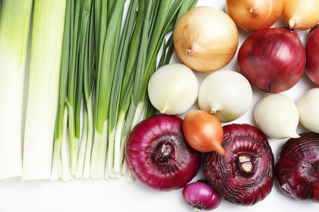 Photo different raw onion isolated on white