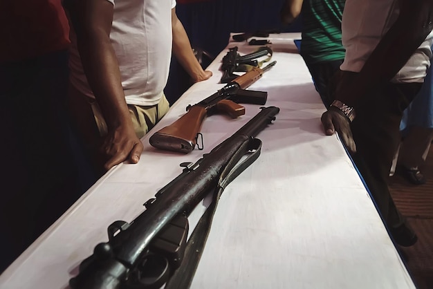 Different rifles on the counter in the gun shop