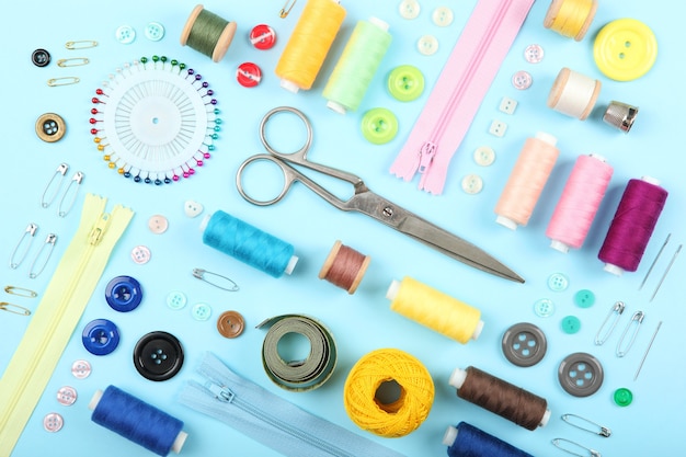 Different sewing accessories on the table closeup