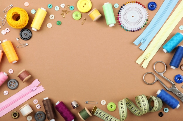 Different sewing accessories on the table closeup