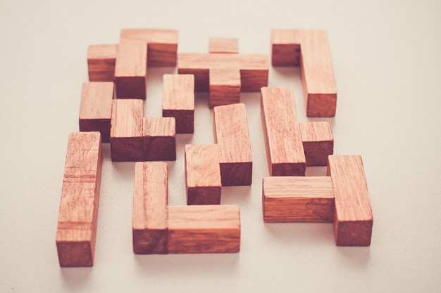 Photo different shapes wooden blocks on white background