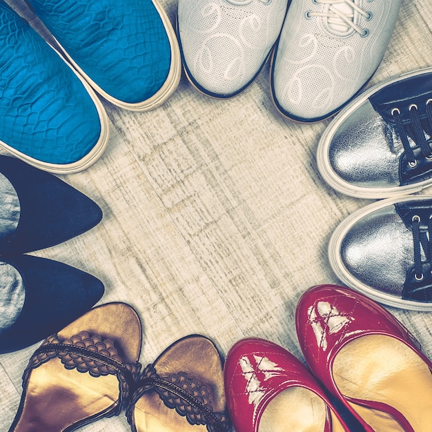 Different shoes laying on floor.